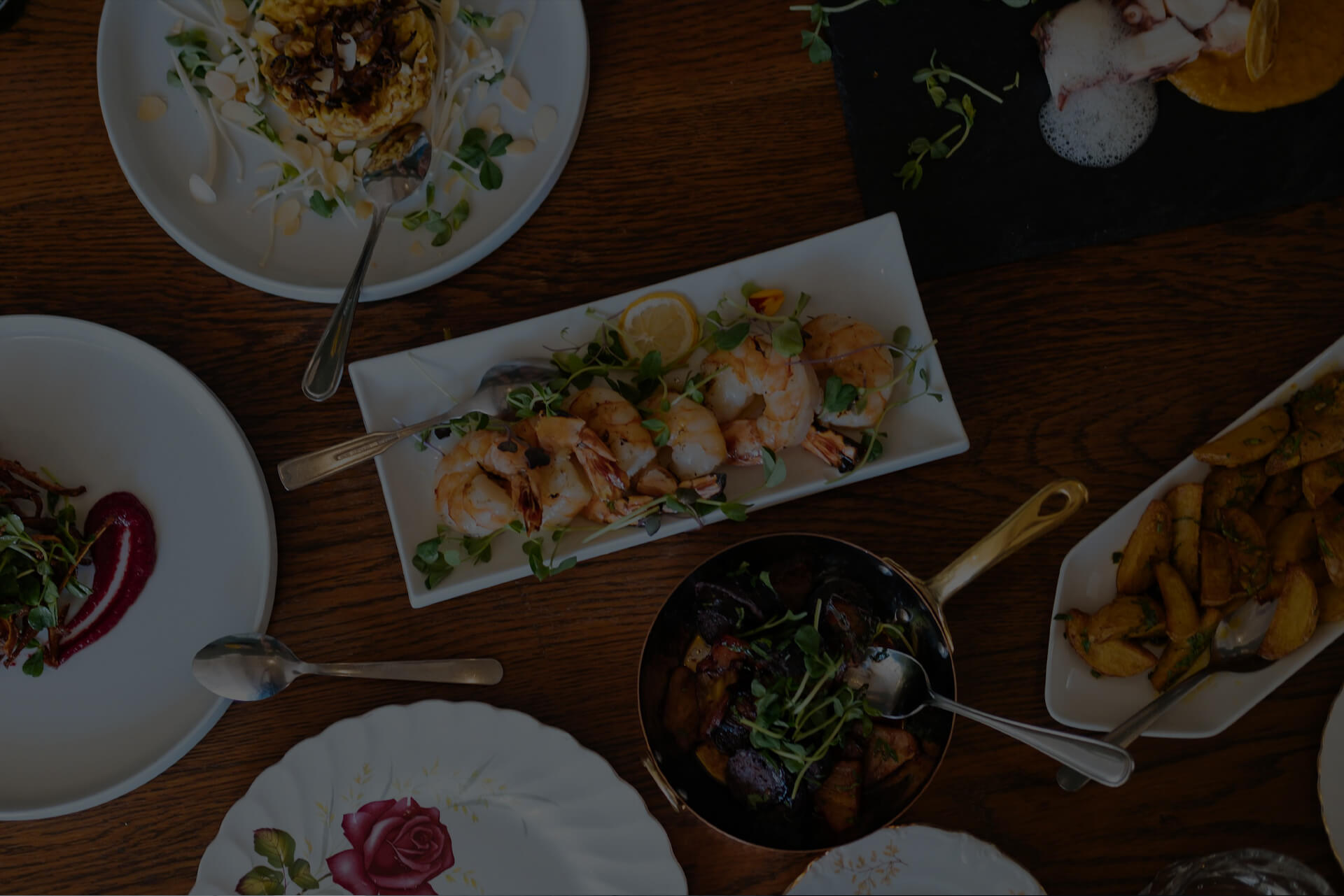 Hero background showing a catered lunch spread in Toronto