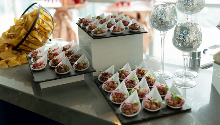 Buffet and cocktail reception setup with canapés and small plates